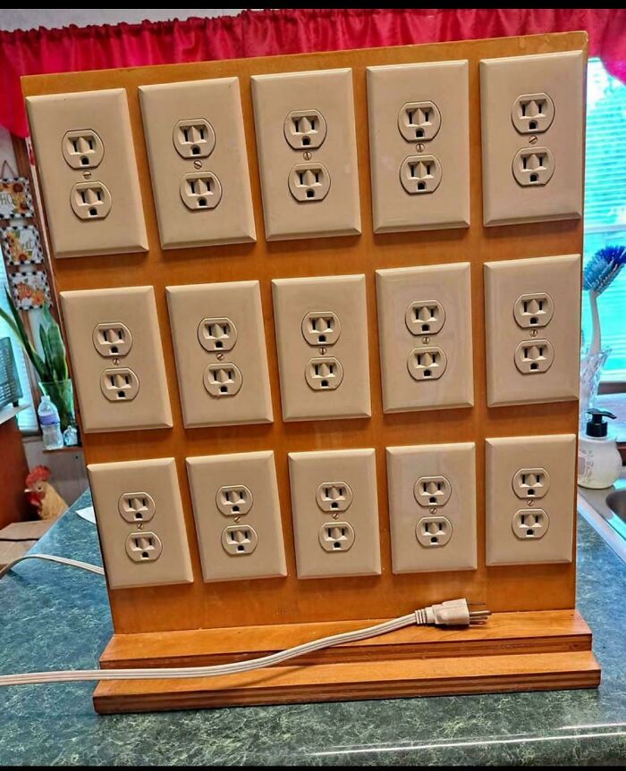 A homemade power strip with 15 electrical outlets and a single plug, a DiWHY project that failed miserably.