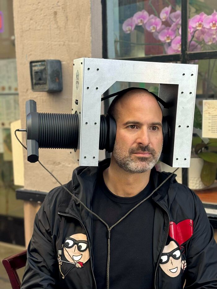 Man wearing a bizarre DiWHY homemade headset contraption, illustrating an example of people trying to do it themselves.