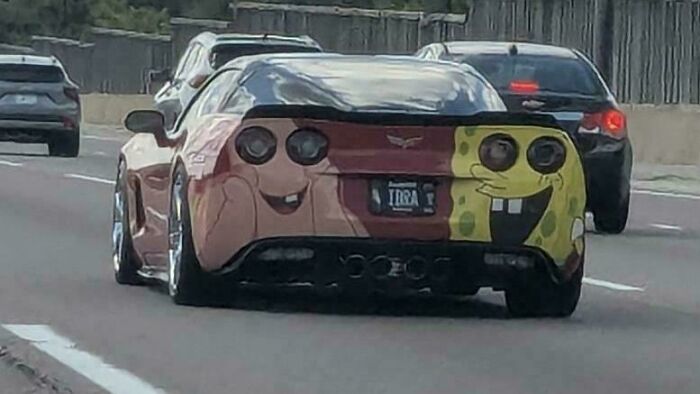 A car with a custom DiWHY paint job, depicting Patrick Star and Spongebob Squarepants on the back.