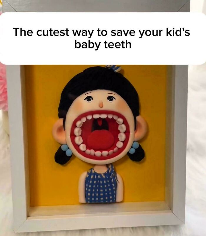 A framed DiWHY art project of a cartoon face with a wide-open mouth to save baby teeth.