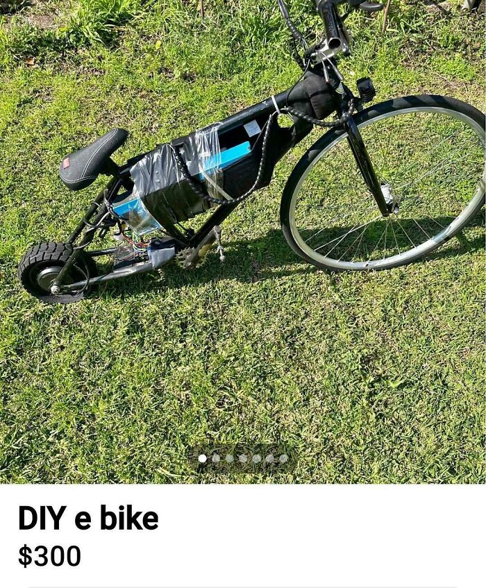 A "DiWHY" e-bike on grass, with exposed wiring and makeshift battery housing, priced at $300.