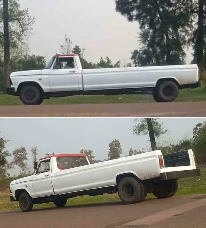 A stretched white pickup truck with a red roof, showcasing a DiWHY project. It has two wheels in the front and four in the back.
