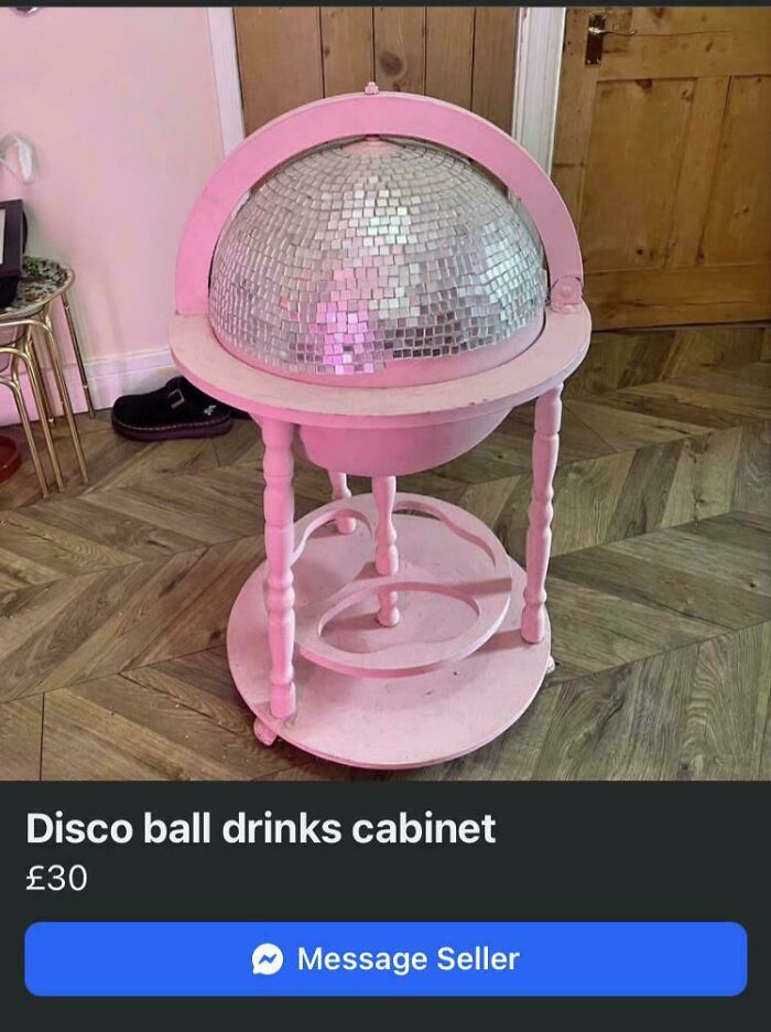 A pink DiWHY disco ball drinks cabinet, a DIY project, sitting on a wooden floor, for sale.