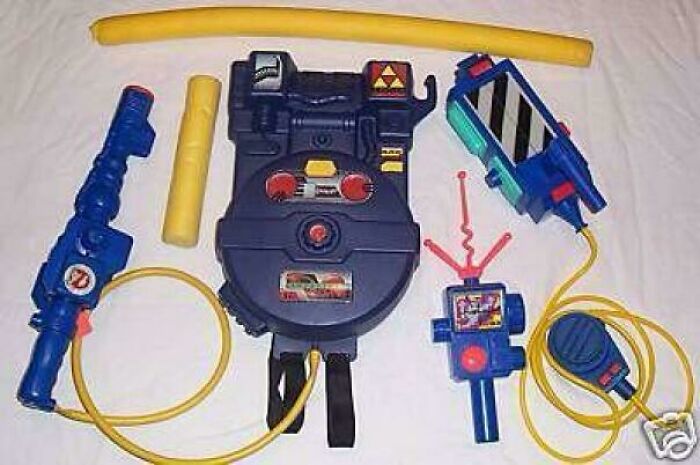 A collection of colorful Ghostbusters toys, a nostalgic meme that takes '90s kids back to childhood playtime.