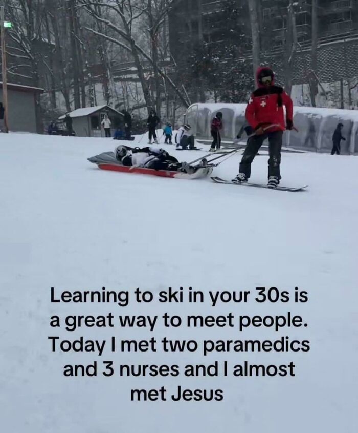 Skier in red pulling injured person on sled in snow with meme about learning to ski and meeting paramedics and nurses.