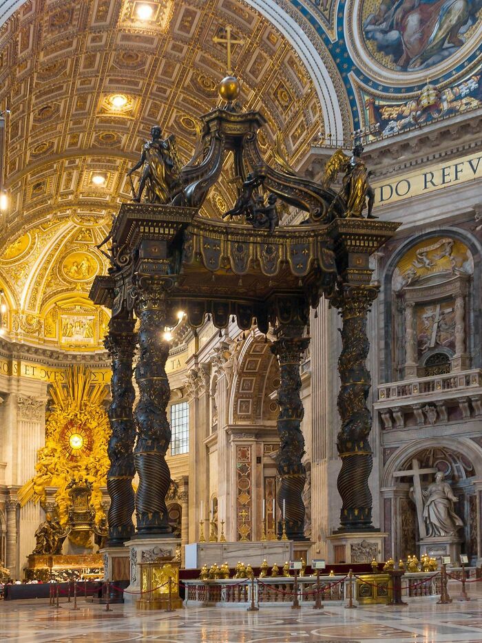 The Baldachin in St. Peter's Basilica, a masterpiece of architecture, showcasing intricate details and golden ceilings.