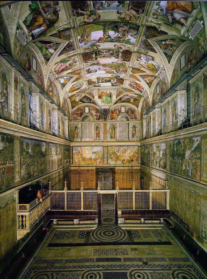 The breathtaking ceiling and wall frescoes of the Sistine Chapel, a true marvel of architecture that impresses all.