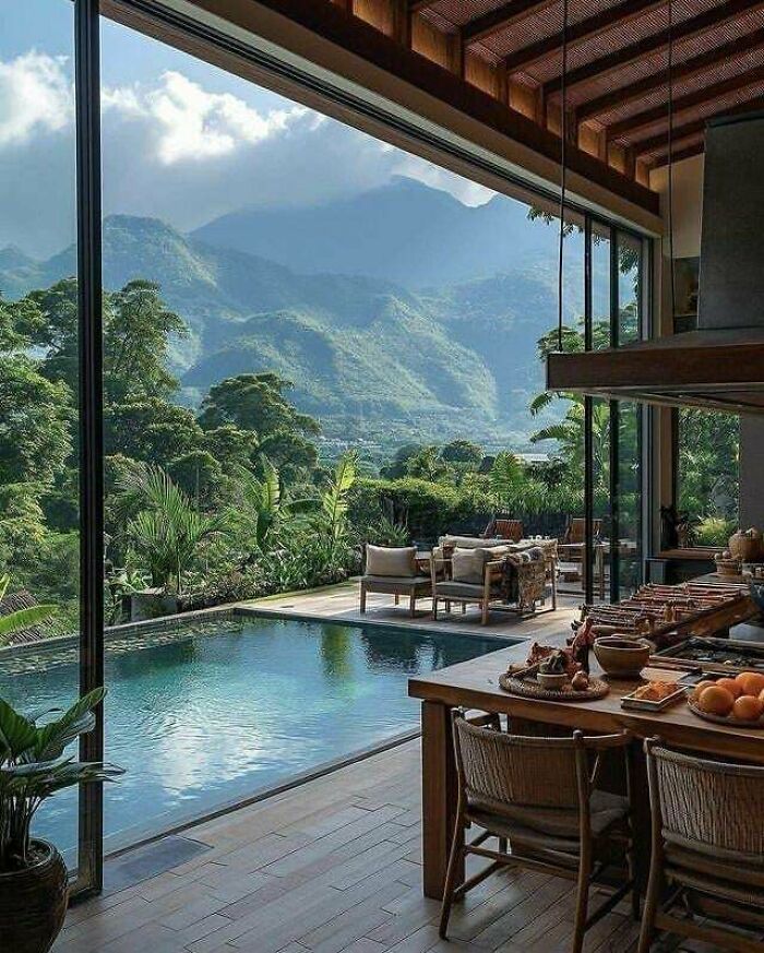 Stunning architecture building with a pool and mountain views. This impressive building offers a luxurious escape.