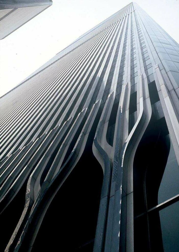 Impressive modern architecture building with striking vertical lines and unique base supports, inspiring architecture lovers.