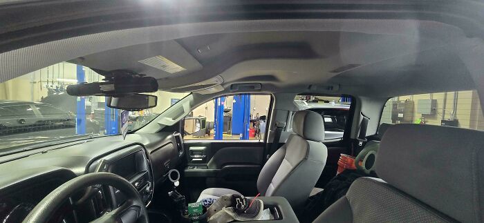 Car mechanics capturing inside vehicle shots showing detailed repairs and issues to make others believe their work.