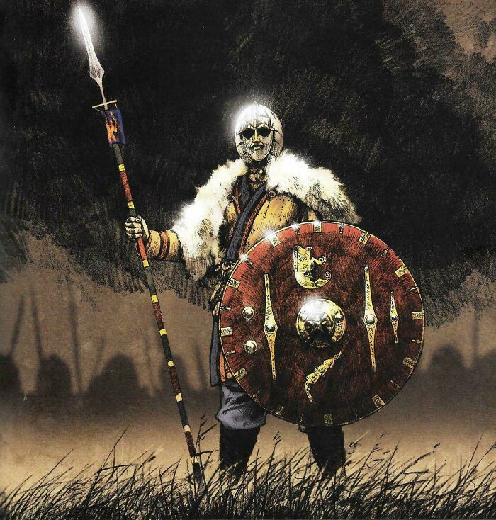 A formidable warrior from the Middle Ages, clad in armor and fur, holding a spear and a round shield.