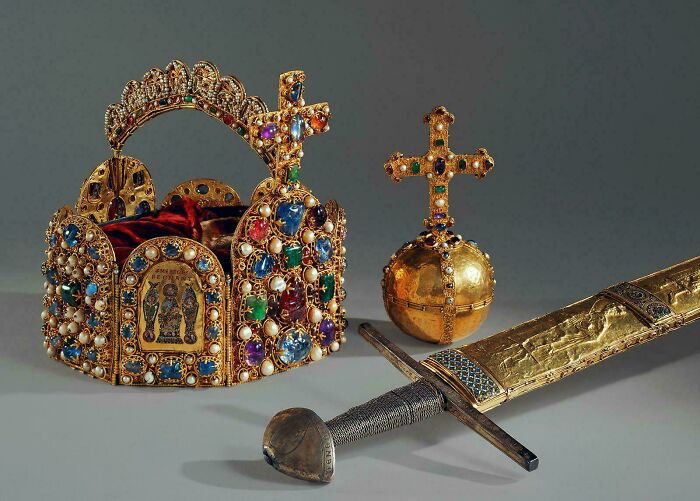 An ornate crown, scepter, and sword from the Middle Ages, revealing a fascinating time of human history.