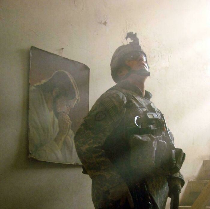 Soldier looking up next to a religious painting in Accidental Renaissance style
