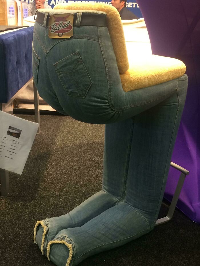 Chair designed to look like a pair of jeans forming human legs, a unique and ridiculous piece of furniture.