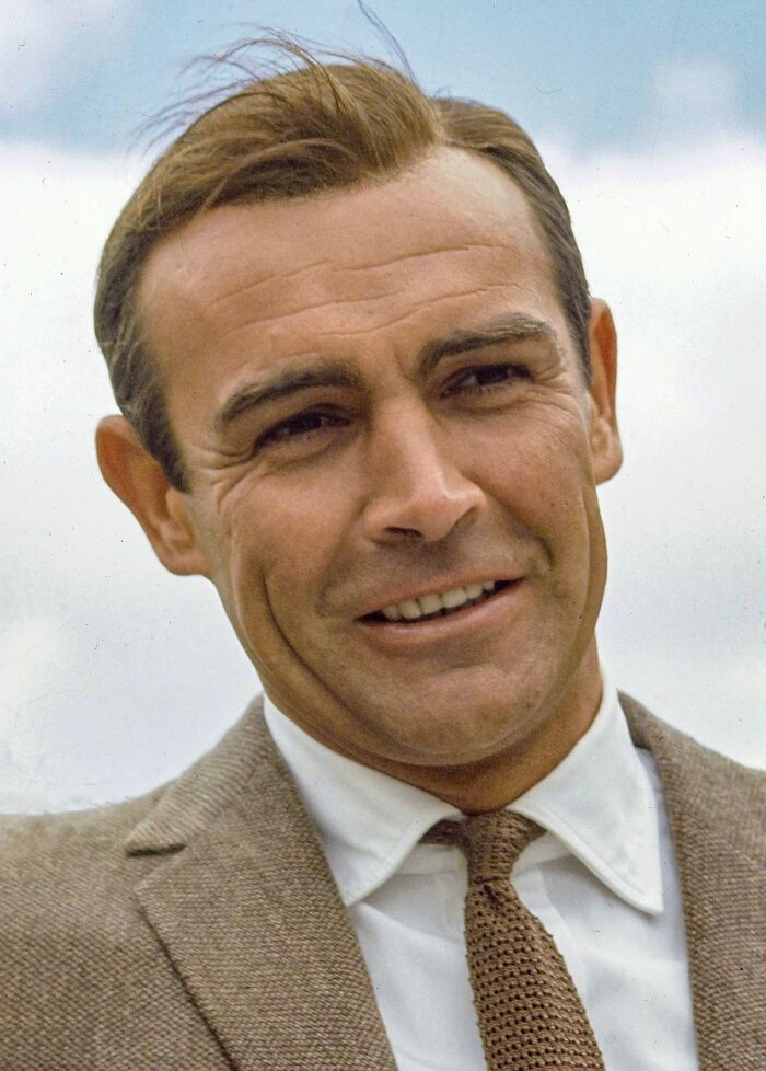 Classic Hollywood actor smiling outdoors, representing iconic actors who dominated Hollywood but vanished without explanation.