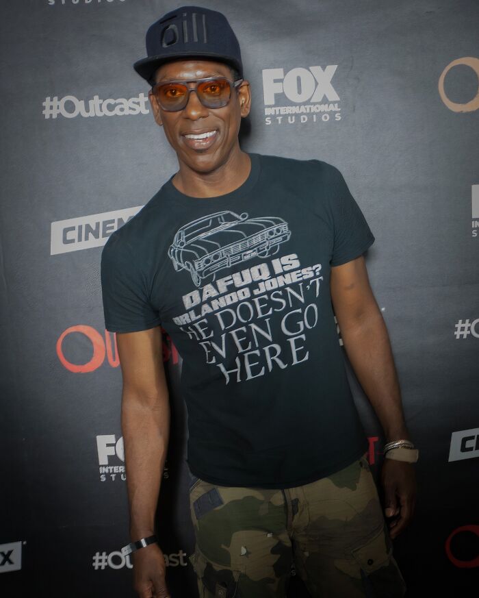 Actor wearing sunglasses and a cap, posing at a Hollywood event featuring iconic actors who vanished unexpectedly.