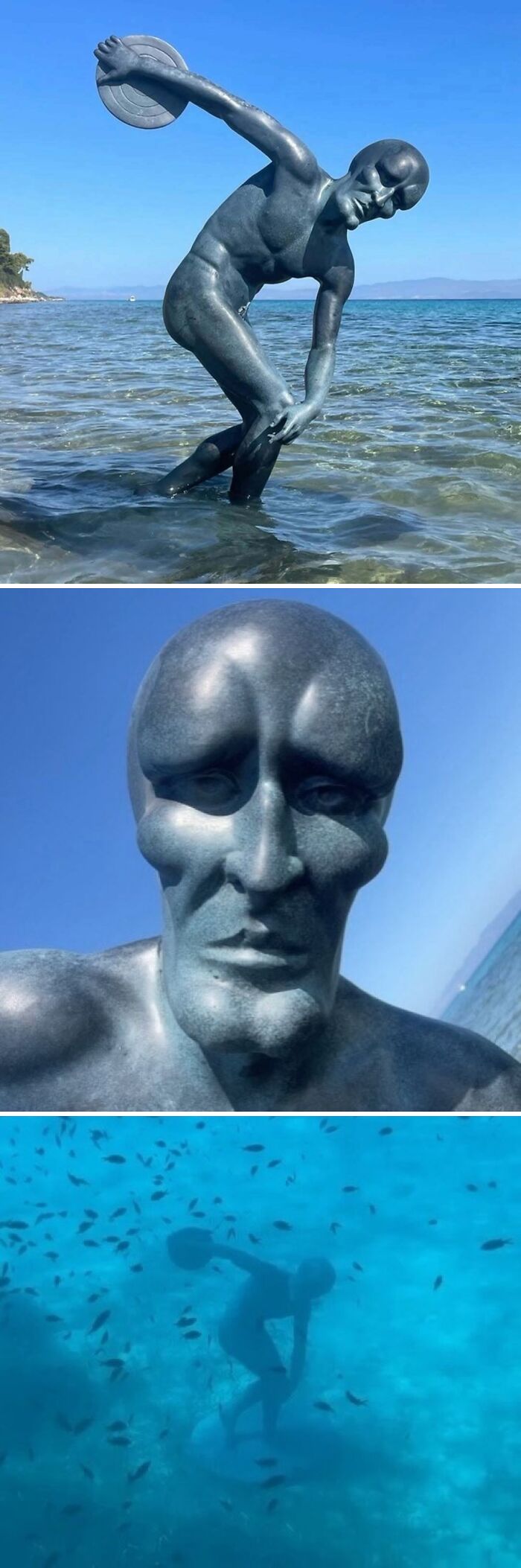 Weirdly hilarious statue of a man throwing a discus partially submerged in water, surrounded by fish underwater.