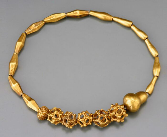 Antique gold necklace with intricate hollow beads, an almost perfectly preserved item revealing secrets of history.