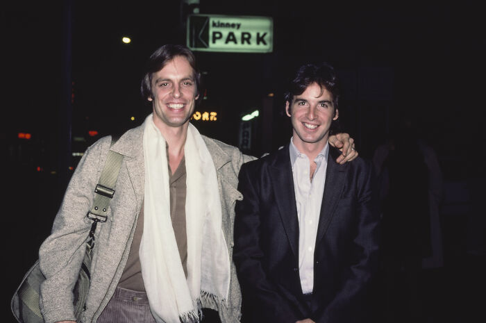 Two men smiling at Kinney Park, related to Robert Carradine and Disney's controversial Lizzie McGuire decision.
