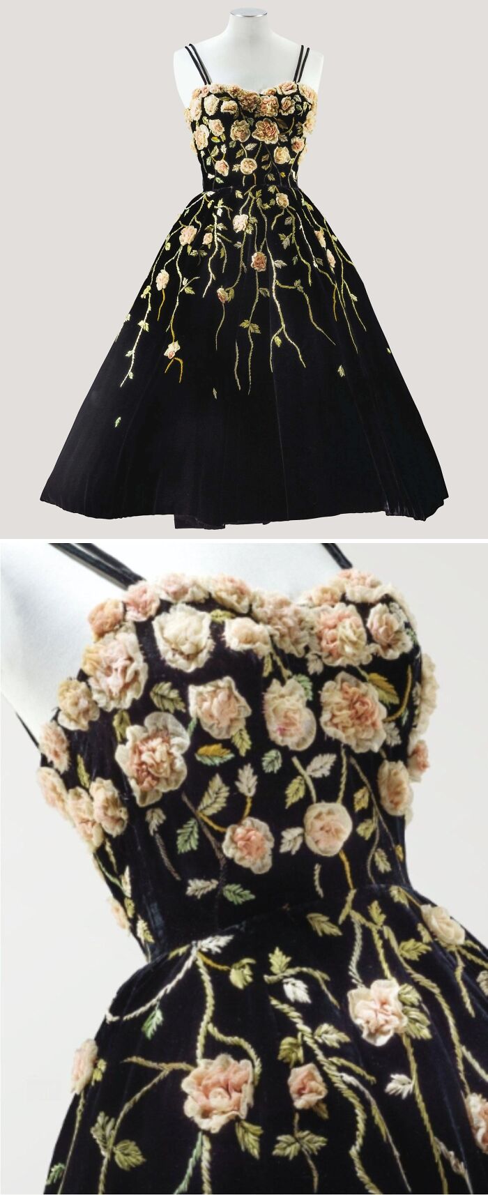 Black historical garment dress adorned with intricate embroidered pink flowers and green vines on a fitted bodice and full skirt.