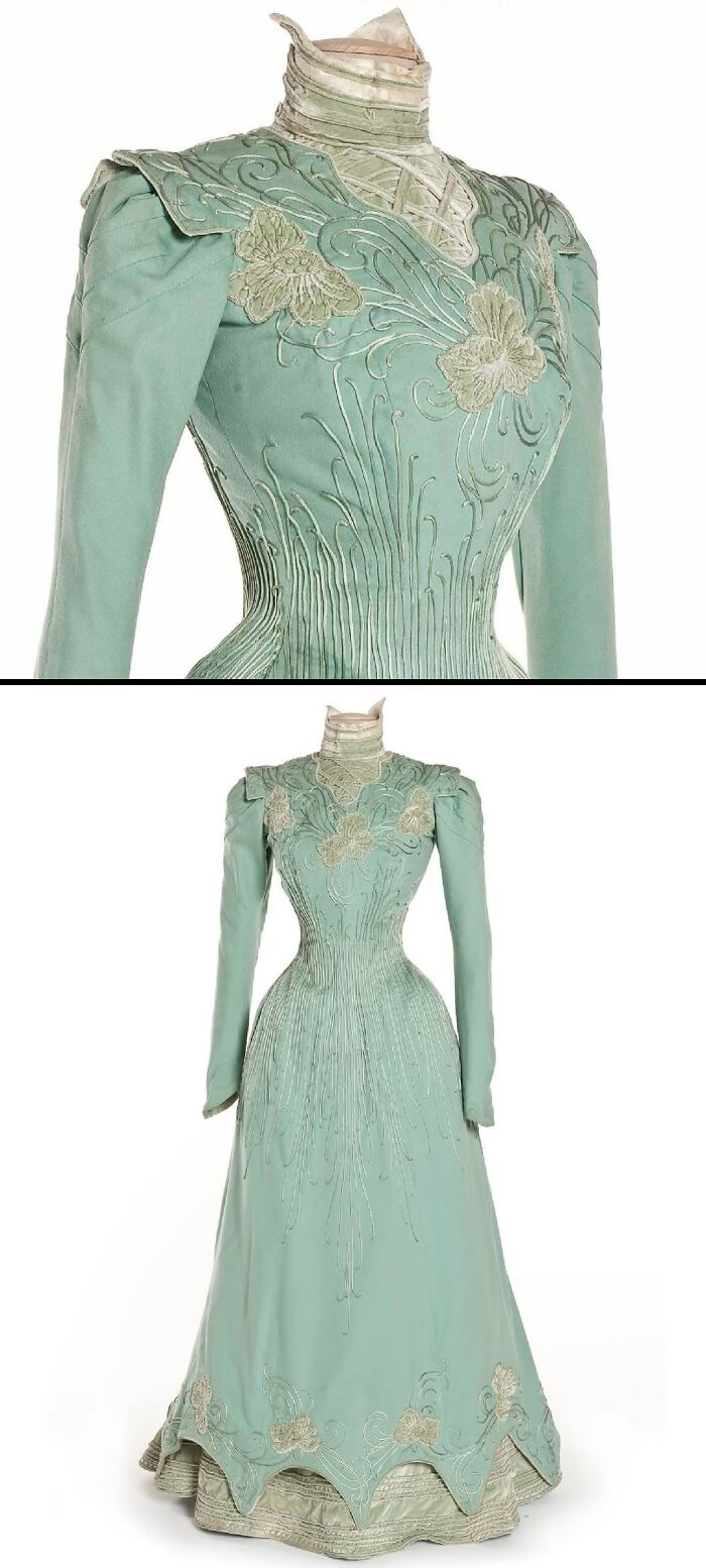 Light green historical garment with embroidered floral details and high collar, showcasing vintage style and intricate design.