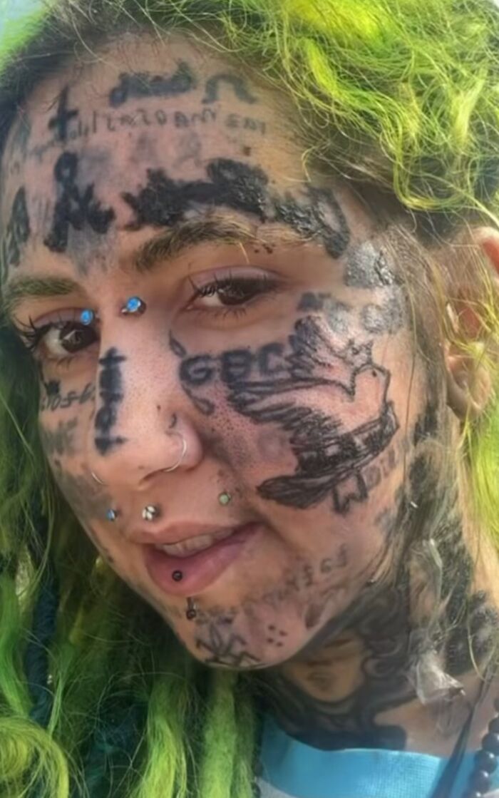 Person with bright green hair and multiple face tattoos, showing examples of terrible tattoos marking people forever.