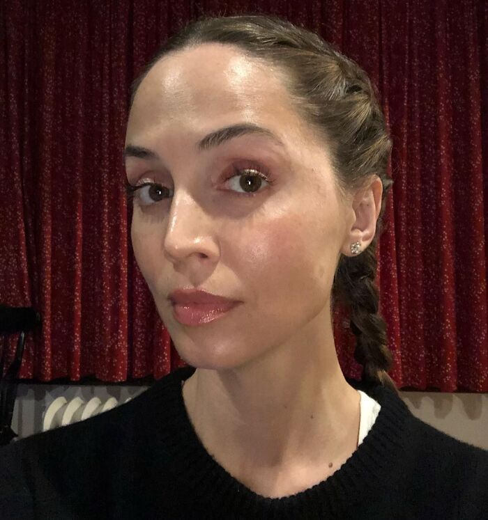 Close-up of a woman with braided hair and natural makeup, representing iconic actors who dominated Hollywood.