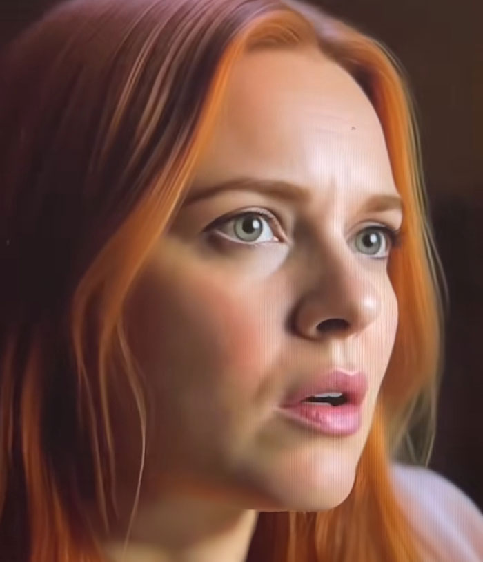 Close-up of a woman with red hair, expressing concern in a scene from the Lucy Letby documentary on Netflix.