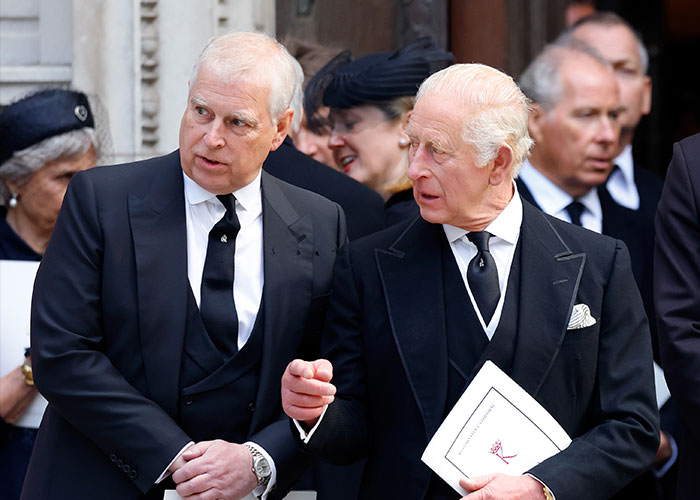 Prince Andrew and King Charles in black suits attending a formal event highlighting royal expert concerns. Prince Andrew and King Charles in black suits attending a formal event highlighting royal expert concerns.