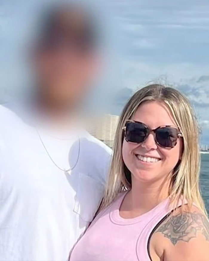 School employee wearing sunglasses outdoors, smiling near a blurred person, related to a disturbing confession video.