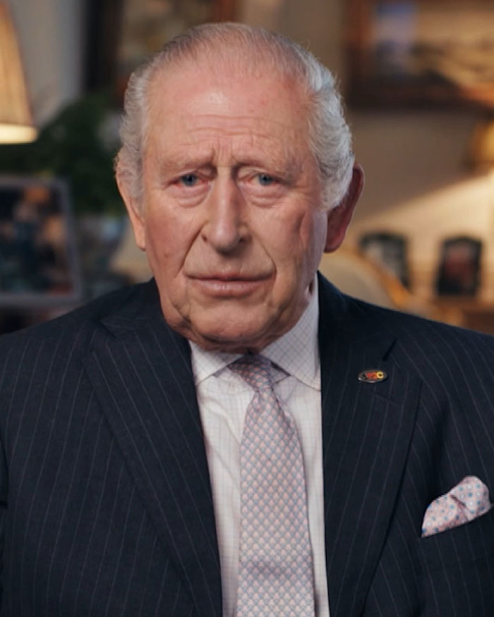 King Charles in a formal suit, looking serious in an indoor setting, highlighting royal expert concerns about Prince Andrew's arrest. King Charles in a formal suit, looking serious in an indoor setting, highlighting royal expert concerns about Prince Andrew's arrest.