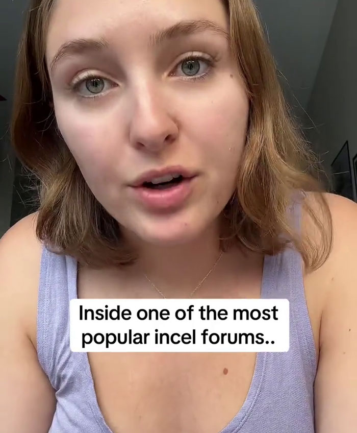 Young woman speaking on camera in a casual setting discussing experiences inside popular incel forums undercover.