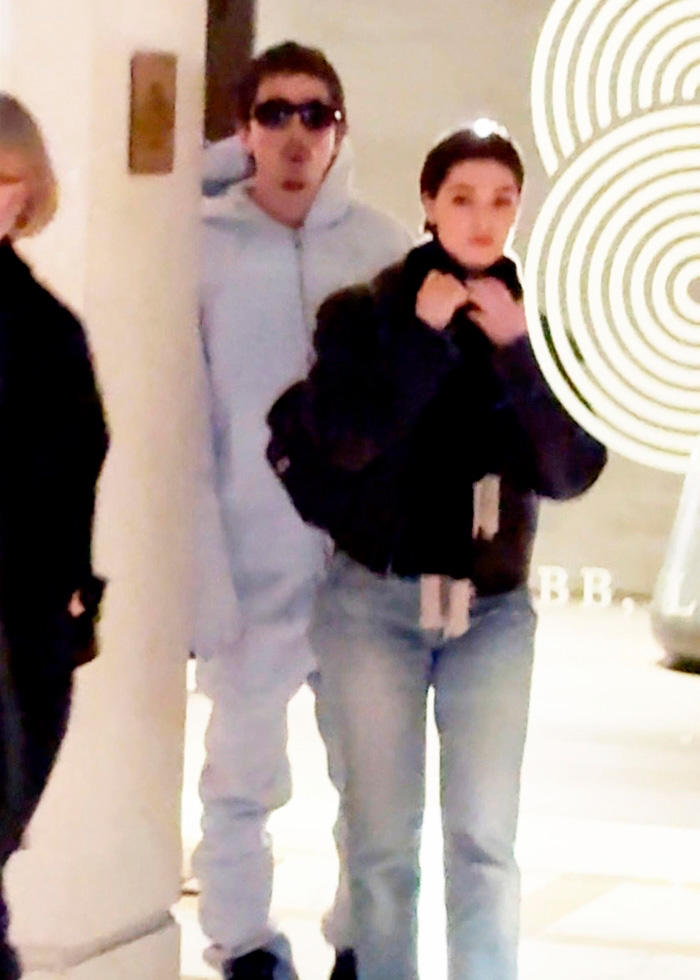 Timoth&eacute;e Chalamet and Anamaria Vartolomei walking outside a hotel, sparking renewed conspiracy theories.