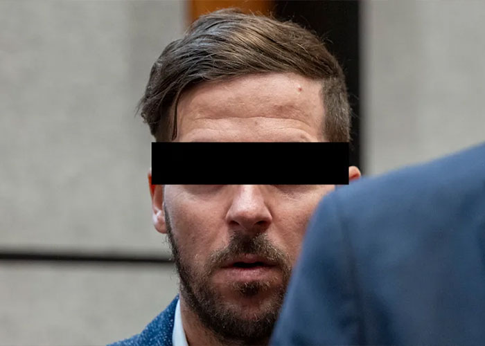 A climber with a black bar over his eyes, involved in a case about girlfriend's heartbreaking last words on mountain.