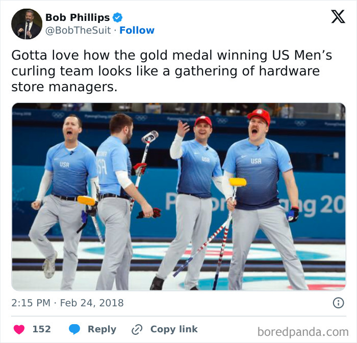 US Men's curling team in blue uniforms celebrating with brooms on ice during a Winter Olympics event.