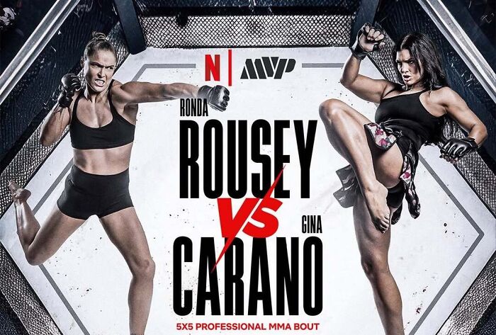 Ronda Rousey and Gina Carano in a dynamic MMA pose inside a cage promoting their Netflix fight event. Ronda Rousey and Gina Carano in a dynamic MMA pose inside a cage promoting their Netflix fight event.