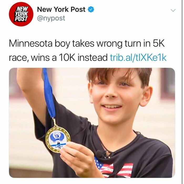 Young boy proudly shows a 10K race medal after accidentally winning by taking a wrong turn in an unhinged America news headline.