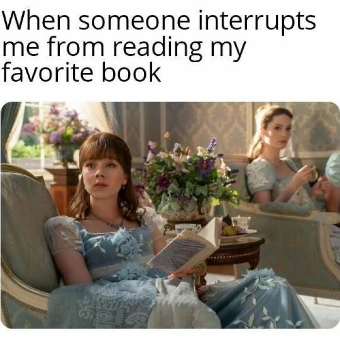 Scene from Bridgerton with a woman in a blue dress reading a book, expressing frustration at being interrupted.