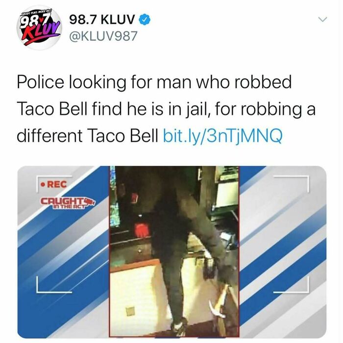 Tweet from 98.7 KLUv reporting a man robbed one Taco Bell while jailed for robbing a different Taco Bell, highlighting unhinged news headlines.