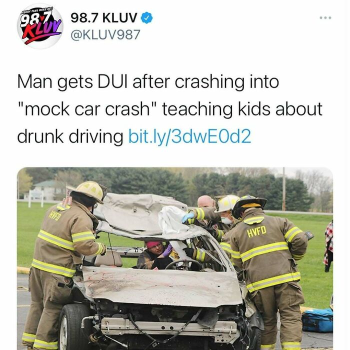 Firefighters assist people in a wrecked vehicle during a mock car crash, illustrating unhinged news headlines in America.