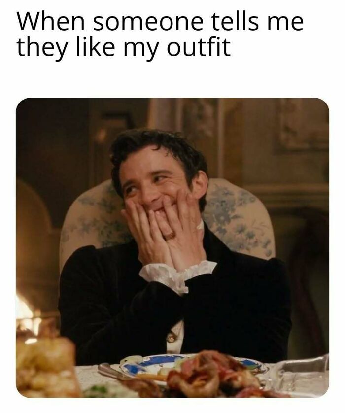 Man from Bridgerton smiling shyly at the dinner table, relatable Bridgerton memes fans of the show might love.