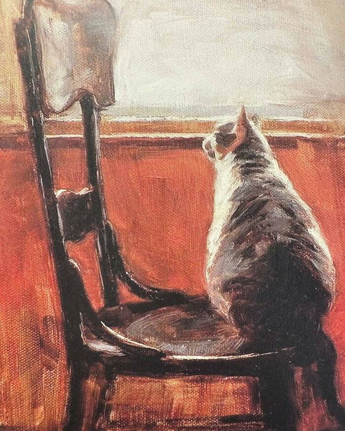 Painting of a cat sitting on a wooden chair by a window, showcasing cats as a favorite art subject throughout the years.