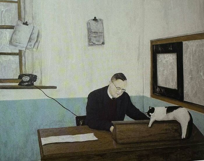 Man working at a desk with a black and white cat beside him in a painting highlighting cats as favorite art subjects.