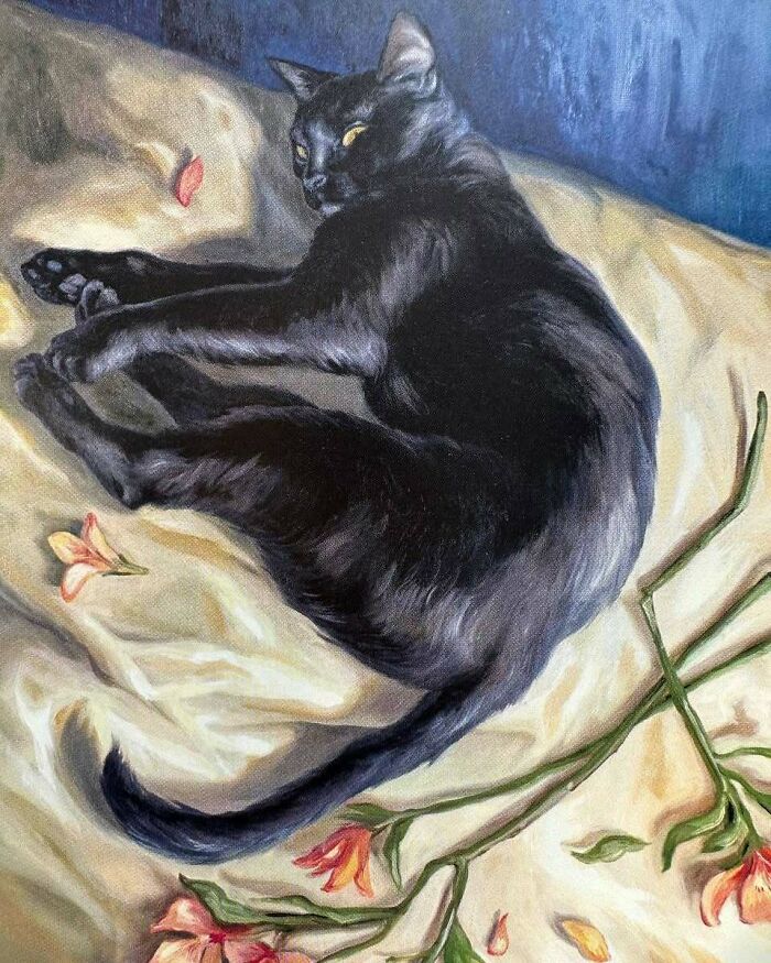 Painting of a black cat resting on a cream cloth with orange flowers, showcasing cats as a favorite art subject through the years.