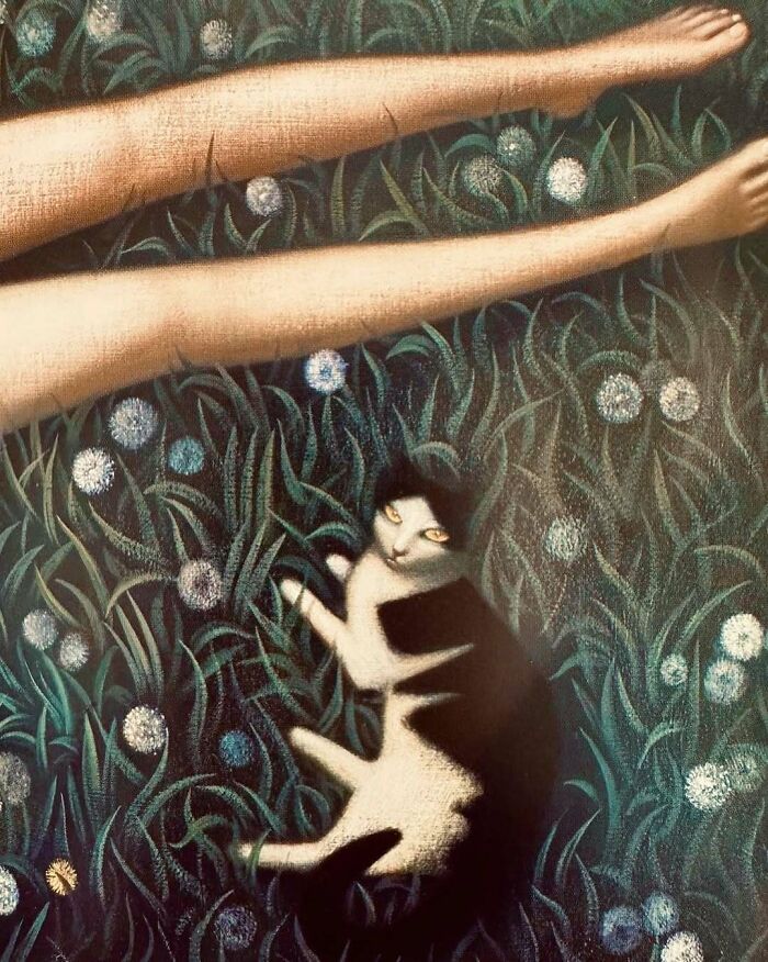 Painting of a black and white cat lying in grass with flowers near a person’s bare legs, showcasing cats as favorite art subjects.