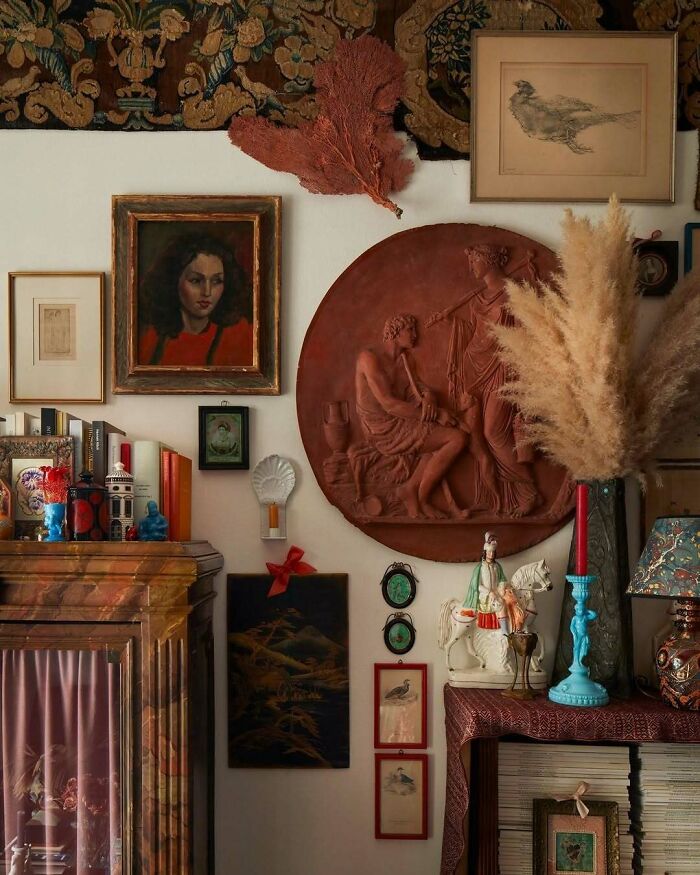 Vintage bold and beautiful interior with eclectic art, sculptures, and decorative items in an inspiring living space.