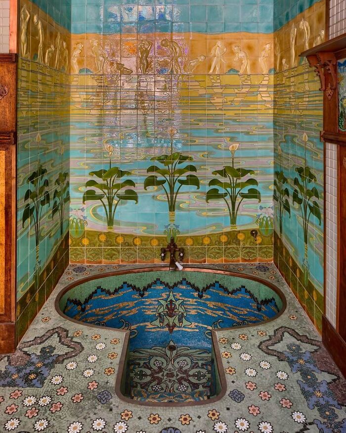 Ornate interior with colorful mosaic tiles and artistic plant and water designs in a bold and beautiful interior setting