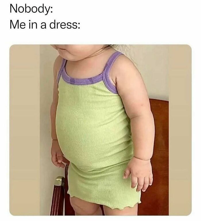 Toddler girl wearing a snug green and purple dress, featured in cute and wholesome posts for girlies online.
