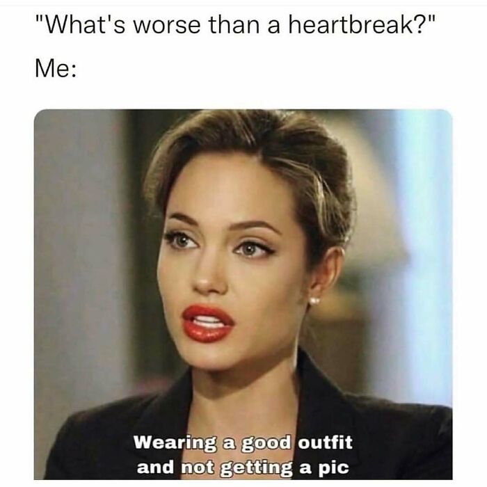 Woman with styled hair and red lipstick expressing frustration about wearing a good outfit and not getting a picture, cute and wholesome post.