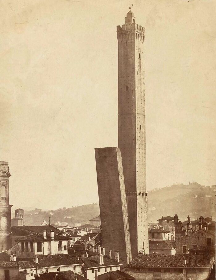 Historic tall architectural structures towering over a cityscape, showcasing humanity's creativity in design and construction.